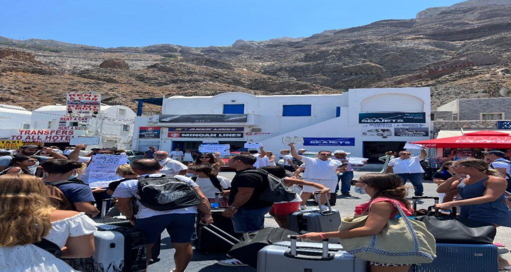 Drivers holding signs at Athinios ferry port